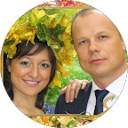 Smiling couple outdoors in autumn, surrounded by yellow and orange leaves on a sunny day